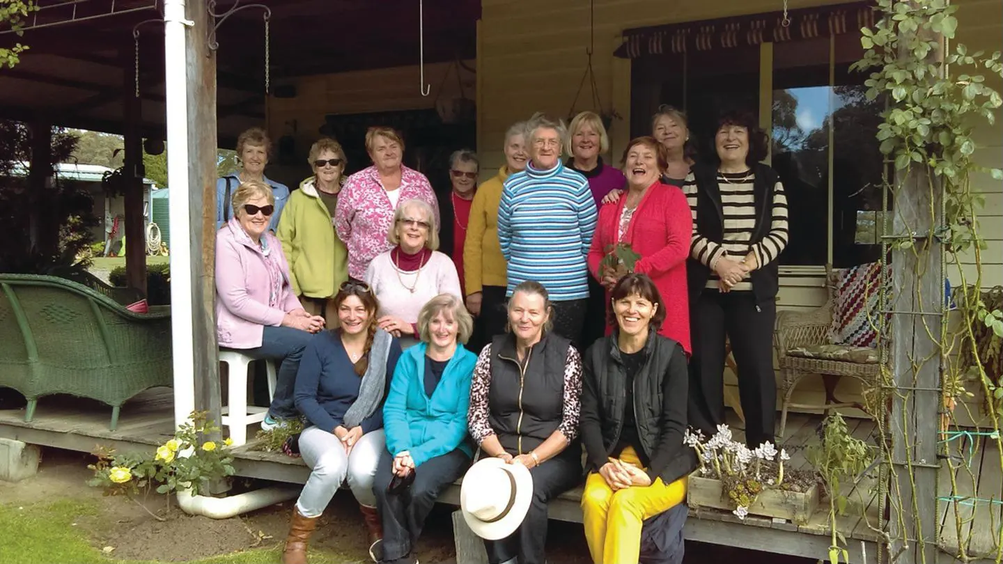 Members of the Garden Group together on a verandah